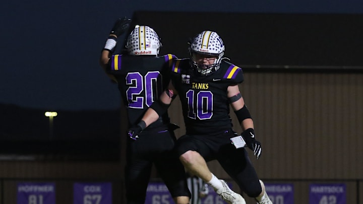 Unioto's Cody Braden (20) celebrates a touchdown with David Long (10). Unioto defeated Paint Valley 43-0 on Friday, Oct. 18. 2024 at Unioto High School. The win earned them at least a share of the Scioto Valley Conference title.