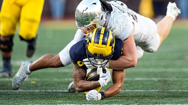 Michigan wide receiver Tyler Morris (8) is tackled by Oregon linebacker Bryce Boettcher (28) during the second half at Michigan Stadium in Ann Arbor on Saturday, Nov. 2, 2024. Michigan wide receiver Tyler Morris (8) is tackled by Oregon linebacker Bryce Boettcher (28) during the second half at Michigan Stadium in Ann Arbor on Saturday, Nov. 2, 2024.