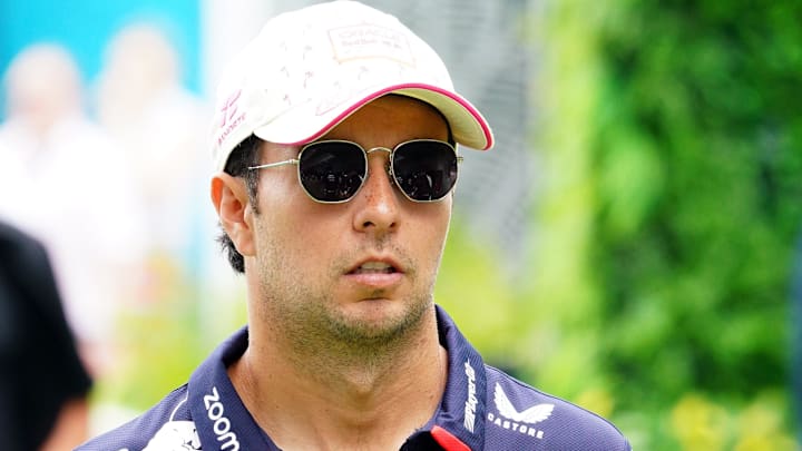 May 5, 2024; Miami Gardens, Florida, USA; Red Bull Racing driver Sergio Perez (11) arrives in the paddock before the Miami Grand Prix at Miami International Autodrome. Mandatory Credit: John David Mercer-USA TODAY Sports