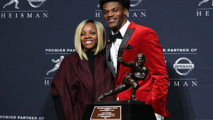 Dec 10, 2016; New York, NY, USA; Louisville quarterback Lamar Jackson and his mother Felicia Jones pose with the trophy during a press conference at the New York Marriott Marquis after winning the 2016 Heisman Trophy award during a presentation at the Playstation Theater. Mandatory Credit: Brad Penner-Imagn Images Dec 10, 2016; New York, NY, USA; Louisville quarterback Lamar Jackson and his mother Felicia Jones pose with the trophy during a press conference at the New York Marriott Marquis after winning the 2016 Heisman Trophy award during a presentation at the Playstation Theater. Mandatory Credit: Brad Penner-Imagn Images
