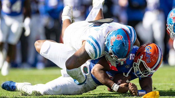 Nov 23, 2024; Gainesville, Florida, USA; Mississippi Rebels defensive tackle Walter Nolen (2) sacks Florida Gators quarterback DJ Lagway (2) during the first half at Ben Hill Griffin Stadium. Mandatory Credit: Matt Pendleton-Imagn Images