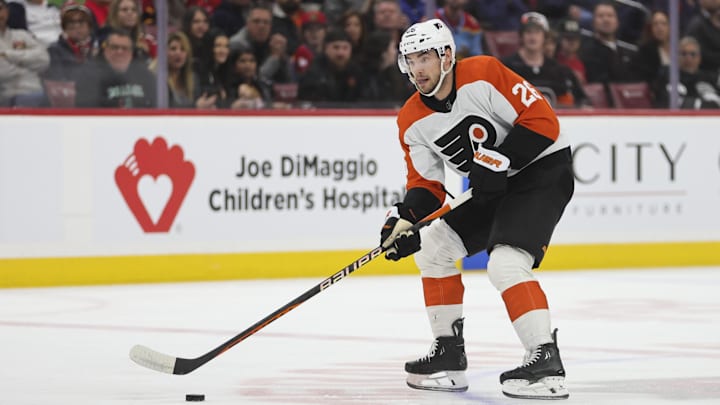 Feb 6, 2024; Sunrise, Florida, USA; Philadelphia Flyers defenseman Sean Walker (26) moves the puck