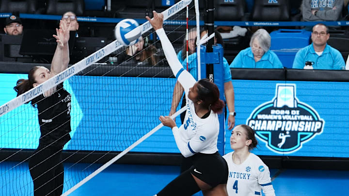 Kentucky's Jordyn Dailey (5) spiked against Cleveland State during the NCAA Women's Volleyball Tournament at Memorial Coliseum in Lexington, Ky. on Dec. 5, 2024.