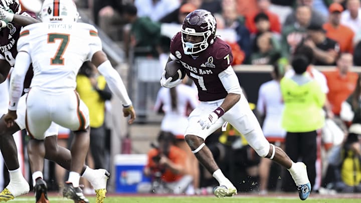 Dec 20, 2025; College Station, TX, USA; Texas A&M Aggies wide receiver KC Concepcion (7) runs the ball against the Miami Hurricanes during the second half at Kyle Field. Mandatory Credit: Maria Lysaker-Imagn Images