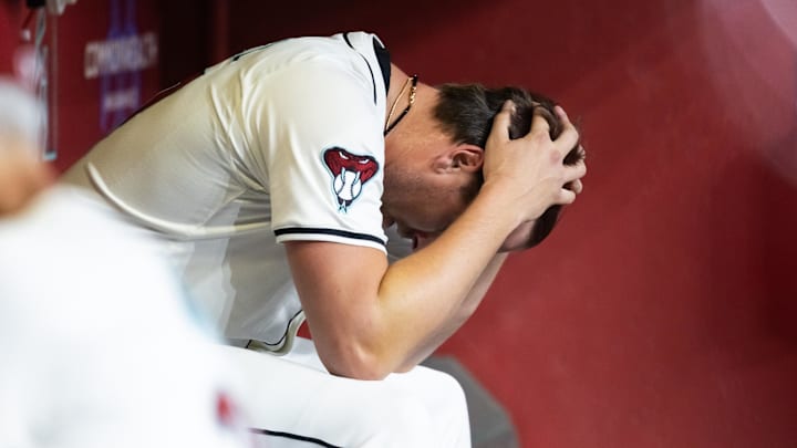 May 27, 2025; Phoenix, Arizona, USA; Arizona Diamondbacks pitcher Kevin Ginkel reacts after being pulled from the game in the eighth inning against the Pittsburgh Pirates at Chase Field. Mandatory Credit: Mark J. Rebilas-Imagn Images
