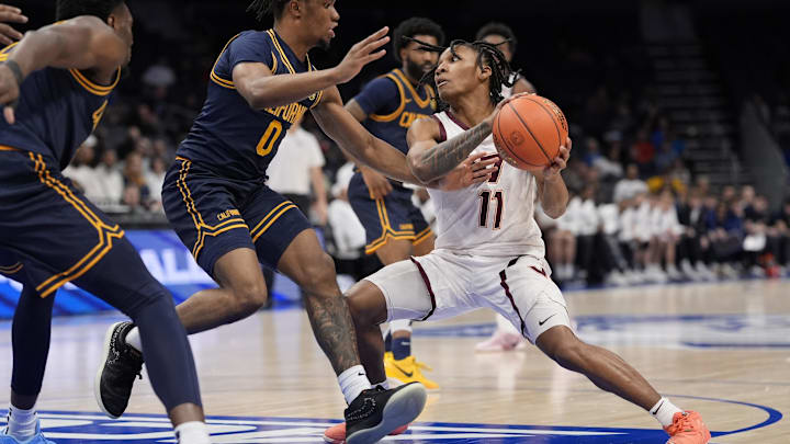 Mar 11, 2025; Charlotte, NC; Virginia Tech guard Ben Hammond (11) drives to the basket.