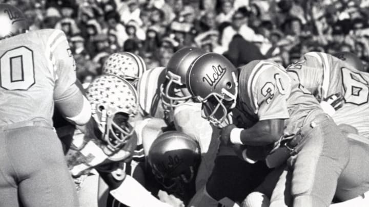 Jan 1, 1976; Pasadena, CA, USA; FILE PHOTO; UCLA Bruins halfback Eddie Ayers (30) runs with the ball against the Ohio State Buckeyes during the 1976 Rose Bowl. The Bruins defeated the Buckeyes 23-10. Mandatory Credit: Malcolm Emmons-Imagn Images