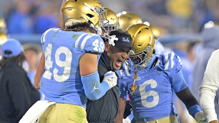 UCLA defensive coordinator Ikaika Malloe, the former UW player and coach, celebrates with his players. UCLA defensive coordinator Ikaika Malloe, the former UW player and coach, celebrates with his players.