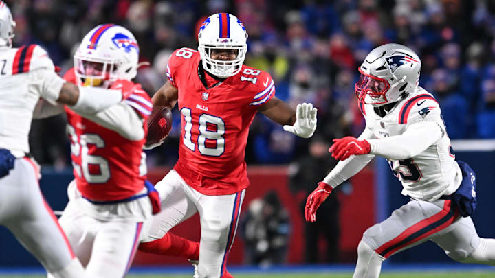 Dec 22, 2024; Orchard Park, New York, USA; Buffalo Bills wide receiver Amari Cooper (18) stiff arms New England Patriots linebacker Christian Elliss (53) in the second quarter at Highmark Stadium. Mandatory Credit: Mark Konezny-Imagn Images Dec 22, 2024; Orchard Park, New York, USA; Buffalo Bills wide receiver Amari Cooper (18) stiff arms New England Patriots linebacker Christian Elliss (53) in the second quarter at Highmark Stadium. Mandatory Credit: Mark Konezny-Imagn Images