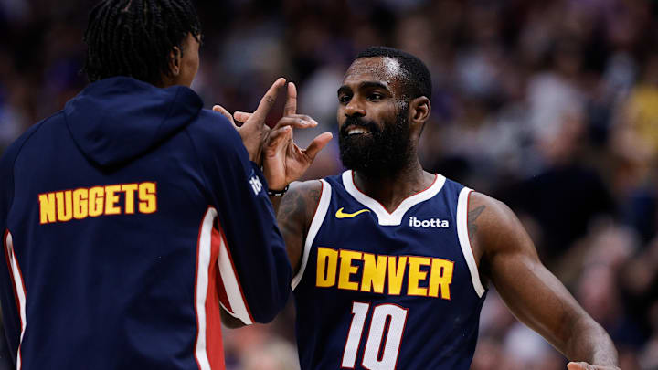 Dec 22, 2025; Denver, Colorado, USA; Denver Nuggets guard Tim Hardaway Jr. (10) celebrates with guard Peyton Watson (8) in the fourth quarter against the Utah Jazz at Ball Arena. Mandatory Credit: Isaiah J. Downing-Imagn Images