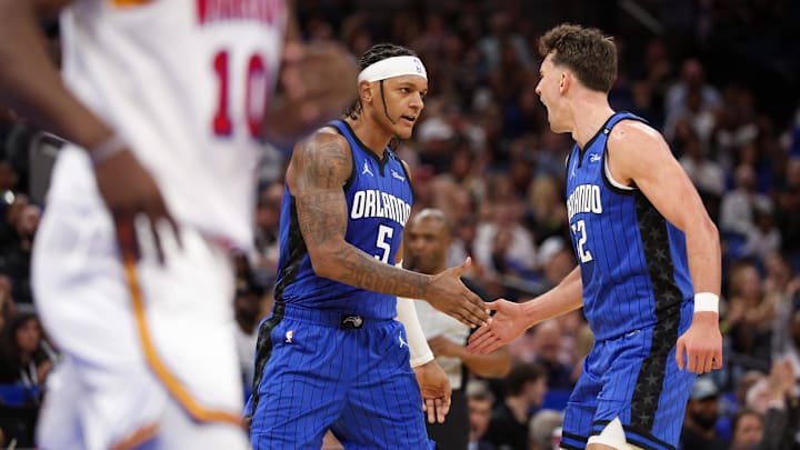 Orlando Magic forward Paolo Banchero (5) and forward Franz Wagner (22) celebrate after a basket against the Golden State Warriors in the second quarter at Kia Center.
