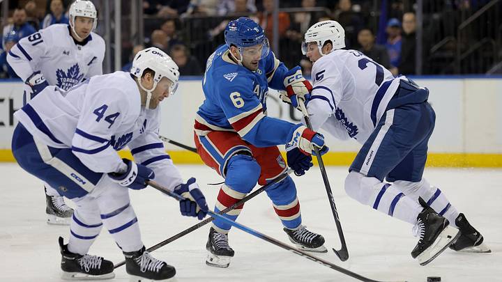 Mar 5, 2026; New York, New York, USA; New York Rangers defenseman Vincent Iorio (6) fights for the puck against Toronto Maple Leafs defensemen Morgan Rielly (44) and Brandon Carlo (25) during the second period at Madison Square Garden. Mandatory Credit: Brad Penner-Imagn Images Mar 5, 2026; New York, New York, USA; New York Rangers defenseman Vincent Iorio (6) fights for the puck against Toronto Maple Leafs defensemen Morgan Rielly (44) and Brandon Carlo (25) during the second period at Madison Square Garden. Mandatory Credit: Brad Penner-Imagn Images