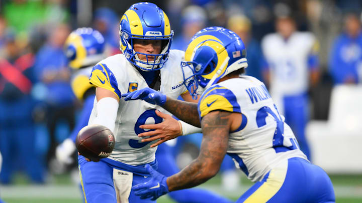 Nov 3, 2024; Seattle, Washington, USA; Los Angeles Rams quarterback Matthew Stafford (9) hands the ball off to running back Kyren Williams (23) during the second half against the Seattle Seahawks at Lumen Field. Mandatory Credit: Steven Bisig-Imagn Images