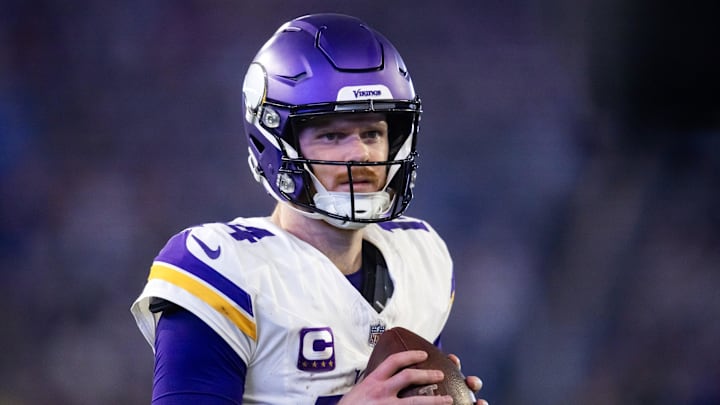 Jan 13, 2025; Glendale, AZ, USA; Minnesota Vikings quarterback Sam Darnold (14) against the Los Angeles Rams during an NFC wild card game at State Farm Stadium. Mandatory Credit: Mark J. Rebilas-Imagn Images