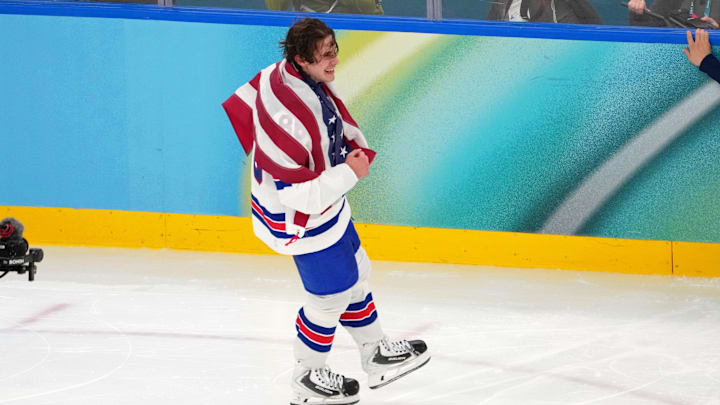 Feb 22, 2026; Milan, Italy; Jack Hughes of the United States celebrates after winning the men's ice hockey gold medal game during the Milano Cortina 2026 Olympic Winter Games at Milano Santagiulia Ice Hockey Arena. Mandatory Credit: James Lang-Imagn Images Feb 22, 2026; Milan, Italy; Jack Hughes of the United States celebrates after winning the men's ice hockey gold medal game during the Milano Cortina 2026 Olympic Winter Games at Milano Santagiulia Ice Hockey Arena. Mandatory Credit: James Lang-Imagn Images
