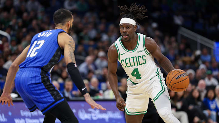 Dec 23, 2024; Orlando, Florida, USA; Boston Celtics guard Jrue Holiday (4) is guarded by Orlando Magic guard Trevelin Queen (12) in the first quarter at Kia Center. Mandatory Credit: Nathan Ray Seebeck-Imagn Images Dec 23, 2024; Orlando, Florida, USA; Boston Celtics guard Jrue Holiday (4) is guarded by Orlando Magic guard Trevelin Queen (12) in the first quarter at Kia Center. Mandatory Credit: Nathan Ray Seebeck-Imagn Images