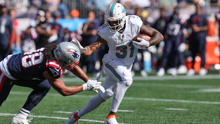 Miami Dolphins running back Raheem Mostert (31) runs the ball during the first half against the New England Patriots at Gillette Stadium. Miami Dolphins running back Raheem Mostert (31) runs the ball during the first half against the New England Patriots at Gillette Stadium.