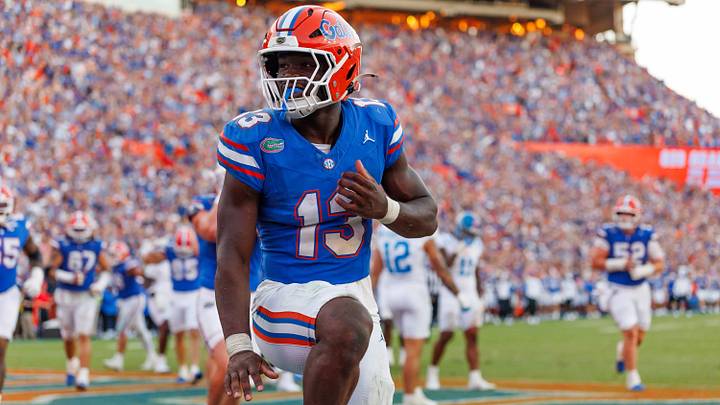 Florida Gators running back Jadan Baugh (13) celebrates with a Heisman pose Florida Gators running back Jadan Baugh (13) celebrates with a Heisman pose