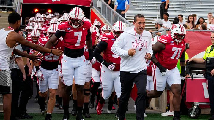 Sep 12, 2026; Madison, Wisconsin, USA;  Wisconsin Badgers head coach Luke Fickell leads the team onto the field for warmups prior to the game against the Western Illinois Leathernecks at Camp Randall Stadium. Mandatory Credit: Jeff Hanisch-Imagn Images