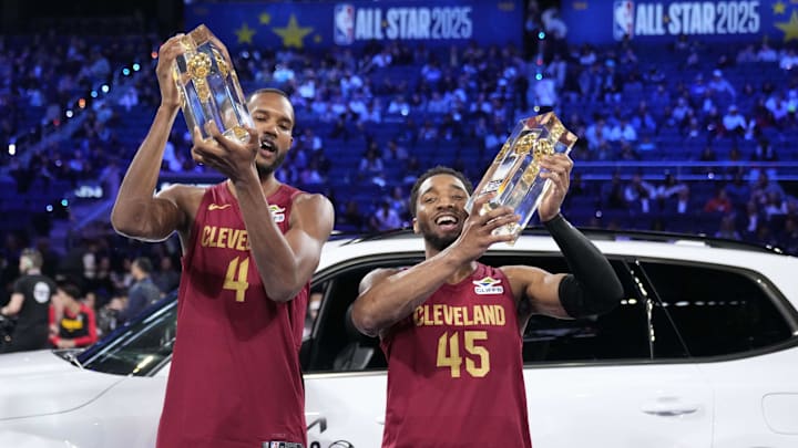 Feb 15, 2025; San Francisco, CA, USA; Team Cavs center Evan Mobley (4) and guard Donovan Mitchell (45) of the Cleveland Cavaliers celebrate with the trophies after winning the skills challenge during All Star Saturday Night ahead of the 2025 NBA All Star Game at Chase Center. Mandatory Credit: Kyle Terada-Imagn Images