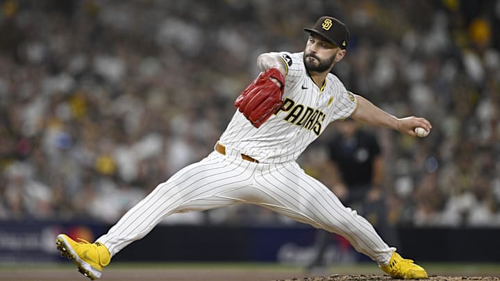 Oct 2, 2024; San Diego, California, USA; San Diego Padres pitcher Tanner Scott (66) throws during the sixth inning of game two in the Wildcard round for the 2024 MLB Playoffs against the Atlanta Braves at Petco Park. Mandatory Credit: Denis Poroy-Imagn Images Oct 2, 2024; San Diego, California, USA; San Diego Padres pitcher Tanner Scott (66) throws during the sixth inning of game two in the Wildcard round for the 2024 MLB Playoffs against the Atlanta Braves at Petco Park. Mandatory Credit: Denis Poroy-Imagn Images