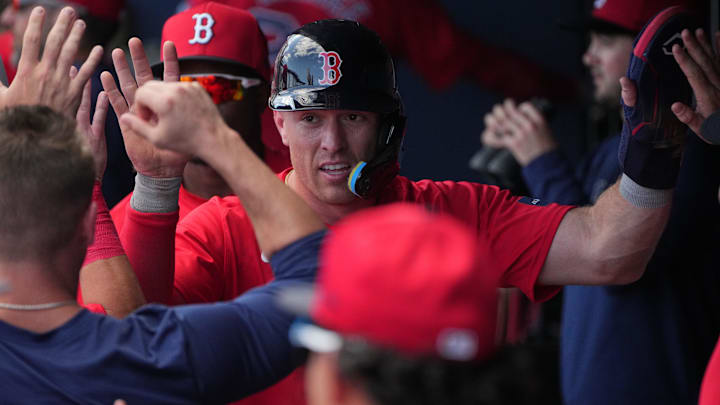 Feb 28, 2024; West Palm Beach, Florida, USA;  Boston Red Sox shortstop Romy Gonzalez (center)