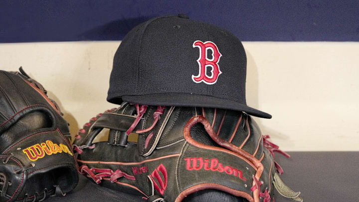 May 27, 2025; Milwaukee, Wisconsin, USA; A Boston Red Sox hat and glove sit in the dug out before a game against the Milwaukee Brewers at American Family Field. Mandatory Credit: Michael McLoone-Imagn Images May 27, 2025; Milwaukee, Wisconsin, USA; A Boston Red Sox hat and glove sit in the dug out before a game against the Milwaukee Brewers at American Family Field. Mandatory Credit: Michael McLoone-Imagn Images