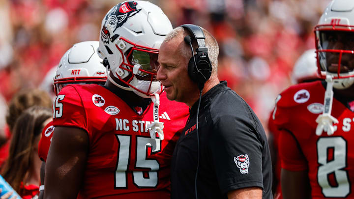 Sep 14, 2024; Raleigh, North Carolina, USA; North Carolina State Wolfpack tight end Justin Joly (15) and head coach Dave Doeren talk during the second half of the game against Louisiana Tech Bulldogs at Carter-Finley Stadium. Mandatory Credit: Jaylynn Nash-Imagn Images Sep 14, 2024; Raleigh, North Carolina, USA; North Carolina State Wolfpack tight end Justin Joly (15) and head coach Dave Doeren talk during the second half of the game against Louisiana Tech Bulldogs at Carter-Finley Stadium. Mandatory Credit: Jaylynn Nash-Imagn Images