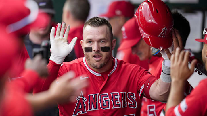 Apr 26, 2026; Kansas City, Missouri, USA; Los Angeles Angels right fielder Mike Trout (27) is congratulated by teammates after after hitting a home run during the first inning against the Kansas City Royals at Kauffman Stadium. Mandatory Credit: Jay Biggerstaff-Imagn Images