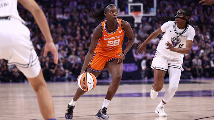 Aug 11, 2025; San Francisco, California, USA; Connecticut Sun guard Migna Toure (28) drives in against Golden State Valkyries guard Tiffany Hayes (15) during the second quarter at Chase Center. Kelley L Cox-Imagn Images Aug 11, 2025; San Francisco, California, USA; Connecticut Sun guard Migna Toure (28) drives in against Golden State Valkyries guard Tiffany Hayes (15) during the second quarter at Chase Center. Kelley L Cox-Imagn Images