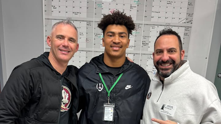 Antoine Sharp stands with FSU head coach Mike Norvell and defensive ends/special teams coach John Papuchis