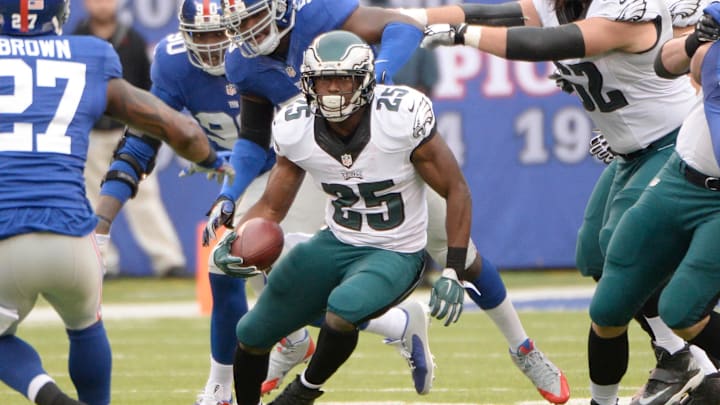 Dec 28, 2014; East Rutherford, NJ, USA; Philadelphia Eagles running back LeSean McCoy (25) runs with the ball against the New York Giants in the first quarter during the game at MetLife Stadium. 