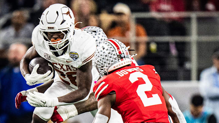 Texas Longhorns running back Quintrevion Wisner (26) runs through Ohio State defense in the second quarter as the Texas Longhorns play the Ohio State Buckeyes in the Cotton Bowl College Football Playoff semi-final at AT&T Stadium in Dallas, Texas, Jan. 10, 2025.