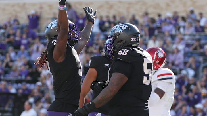 Nov 23, 2024; Fort Worth, Texas, USA; TCU Horned Frogs wide receiver Savion Williams (3) and Bless Harris (58) celebrate a touchdown against the Arizona Wildcats in the first quarter at Amon G. Carter Stadium. Mandatory Credit: Tim Heitman-Imagn Images