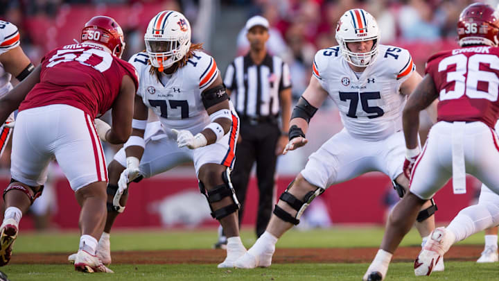 Auburn Tigers offensive linemen Jeremiah Wright and Connor Lew block during the first quarter against the Arkansas Razorbacks.