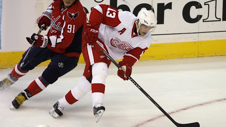 Jan. 31, 2009; Washington, DC, USA; Detroit Red Wings center Pavel Datsyuk (13) handles the puck against Washington Capitals center Sergei Fedorov (91) in the first period at the Verizon Center. Washington won 4-2. Mandatory Credit: Geoff Burke-USA TODAY Sports