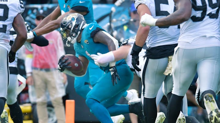 Jacksonville Jaguars running back Travis Etienne Jr. (1) breaks the goal line for a touchdown at the start of the fourth quarter to give the Jaguars a four point lead after the extra point. The Jacksonville Jaguars hosted the Las Vegas Raiders at TIAA Bank Field in Jacksonville, FL Sunday November 6, 2022. The Jaguars trailed 20 to 10 at the end of the first half but came back to win the game with a final score of 27 to 20. [Bob Self/Florida Times-Union]

Jki 110622 Bs Jaguars Vs Raiders 10