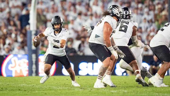 Oregon quarterback Dante Moore scrambles with the ball as the Oregon Ducks face the Penn State Nittany Lions on Sept. 27, 2025, at Beaver Stadium in University Park, Pennsylvania.