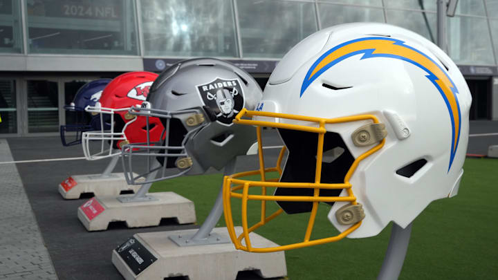Oct 13, 2024; London, United Kingdom; Large helmets of the Los Angeles Chargers, Las Vegas Raiders, Kansas City Chiefs and Denver Broncos of the AFC West before an NFL International Series game at Tottenham Hotspur Stadium. Mandatory Credit: Kirby Lee-Imagn Images Oct 13, 2024; London, United Kingdom; Large helmets of the Los Angeles Chargers, Las Vegas Raiders, Kansas City Chiefs and Denver Broncos of the AFC West before an NFL International Series game at Tottenham Hotspur Stadium. Mandatory Credit: Kirby Lee-Imagn Images
