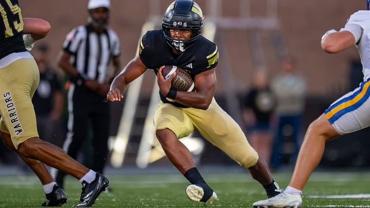 Warren Central High School senior Keyon Thomas (26) runs the ball out of the backfield during the first half of an IHSAA varsity football game against Carmel High School, Friday, Oct. 9, 2026, at WCHS Warrior Stadium in Indianapolis. Warren Central High School senior Keyon Thomas (26) runs the ball out of the backfield during the first half of an IHSAA varsity football game against Carmel High School, Friday, Oct. 9, 2026, at WCHS Warrior Stadium in Indianapolis.