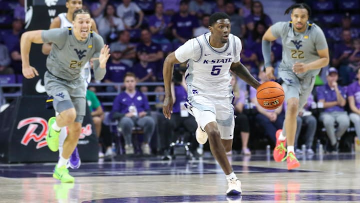 Feb 26, 2024; Manhattan, Kansas, USA; Kansas State Wildcats guard Cam Carter (5) dribbles the ball down the court after a steal against West Virginia.