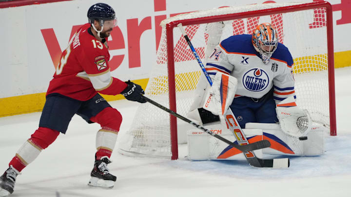 Jun 12, 2025; Sunrise, Florida, USA; Florida Panthers forward Sam Reinhart (13) with a wraparound attempt on Edmonton Oilers goaltender Stuart Skinner (74) during the first period in game four of the 2025 Stanley Cup Final at Amerant Bank Arena. Mandatory Credit: Jim Rassol-Imagn Images