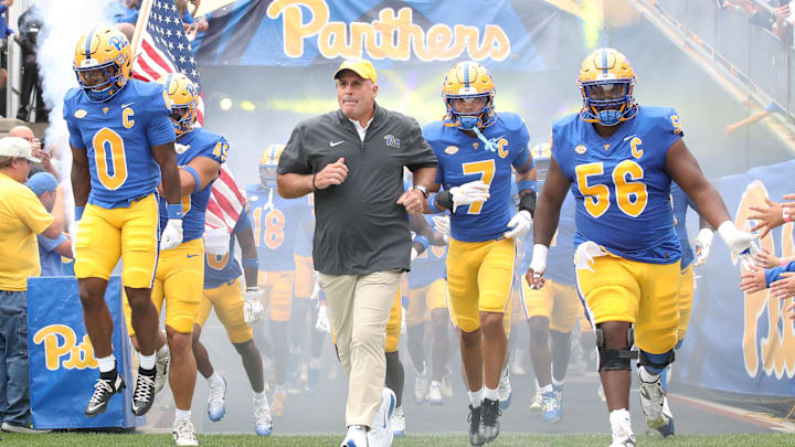 Sep 6, 2025; Pittsburgh, Pennsylvania, USA;  Pittsburgh Panthers running back Desmond Reid (0), head coach Pat Narduzzi, defensive back Javon McIntyre (7) and offensive lineman Lyndon Cooper (56) lead the Panthers onto the field to play the Central Michigan Chippewas  at Acrisure Stadium. Mandatory Credit: Charles LeClaire-Imagn Images