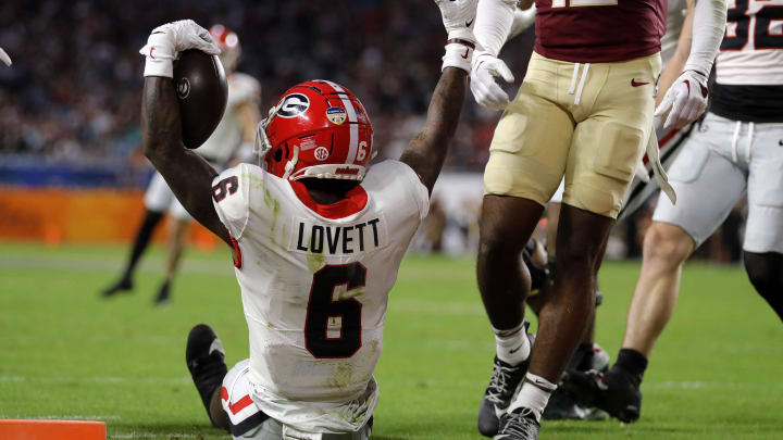 Dec 30, 2023; Miami Gardens, FL, USA; Georgia Bulldogs wide receiver Dominic Lovett (6) reacts after scoring a touchdown against the Florida State Seminoles during the first half in the 2023 Orange Bowl at Hard Rock Stadium. Mandatory Credit: Sam Navarro-USA TODAY Sports Dec 30, 2023; Miami Gardens, FL, USA; Georgia Bulldogs wide receiver Dominic Lovett (6) reacts after scoring a touchdown against the Florida State Seminoles during the first half in the 2023 Orange Bowl at Hard Rock Stadium. Mandatory Credit: Sam Navarro-USA TODAY Sports