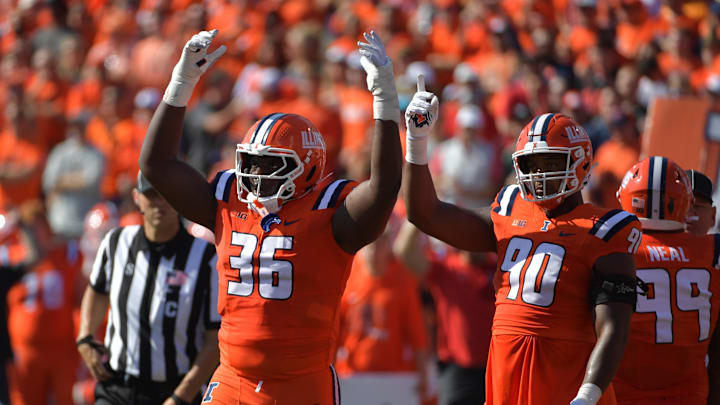 Oct 11, 2025; Champaign, Illinois, USA; Illinois Fighting Illini defensive lineman Tomiwa Durojaiye (36) and defensive lineman James Thompson Jr. (90) react during the first quarter against the Ohio State Buckeyes at Memorial Stadium. Mandatory Credit: Ron Johnson-Imagn Images Oct 11, 2025; Champaign, Illinois, USA; Illinois Fighting Illini defensive lineman Tomiwa Durojaiye (36) and defensive lineman James Thompson Jr. (90) react during the first quarter against the Ohio State Buckeyes at Memorial Stadium. Mandatory Credit: Ron Johnson-Imagn Images