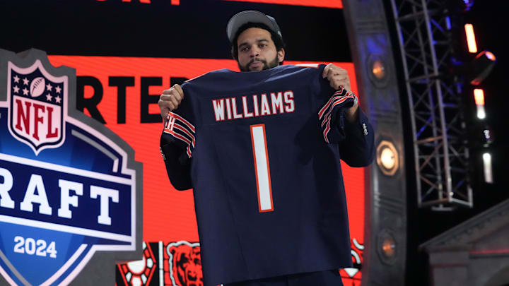 Apr 25, 2024; Detroit, MI, USA; Southern California Trojans quarterback Caleb Williams holds up his