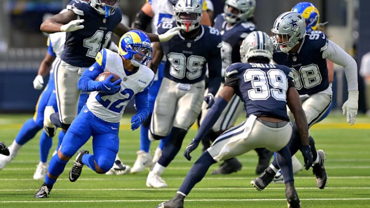 Aug 9, 2025; Inglewood, California, USA;  Los Angeles Rams running back Blake Corum (22) runs past the Dallas Cowboys defense for a first down during the first half at SoFi Stadium. Mandatory Credit: Jayne Kamin-Oncea-Imagn Images
