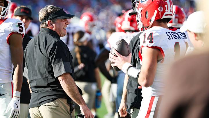 Nov 1, 2025; Jacksonville, Florida, USA; Georgia Bulldogs head coach Kirby Smart speaks with quarterback Gunner Stockton (14) during the second quarter against the Florida Gators at EverBank Stadium. Mandatory Credit: Matt Pendleton-Imagn Images