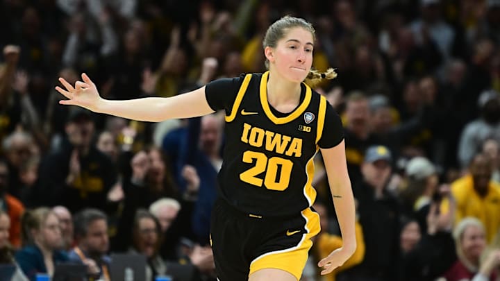 Apr 7, 2024; Cleveland, OH, USA; Iowa Hawkeyes guard Kate Martin (20) reacts after a basket against the South Carolina Gamecocks in the finals of the Final Four of the womens 2024 NCAA Tournament  at Rocket Mortgage FieldHouse. Mandatory Credit: Ken Blaze-Imagn Images