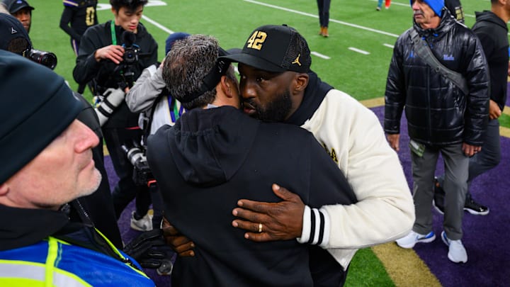 Nov 15, 2024; Seattle, Washington, USA; Washington Huskies head coach Jedd Fisch and UCLA Bruins head coach DeShaun Foster greet each other after the game at Alaska Airlines Field at Husky Stadium. Mandatory Credit: Steven Bisig-Imagn Images Nov 15, 2024; Seattle, Washington, USA; Washington Huskies head coach Jedd Fisch and UCLA Bruins head coach DeShaun Foster greet each other after the game at Alaska Airlines Field at Husky Stadium. Mandatory Credit: Steven Bisig-Imagn Images